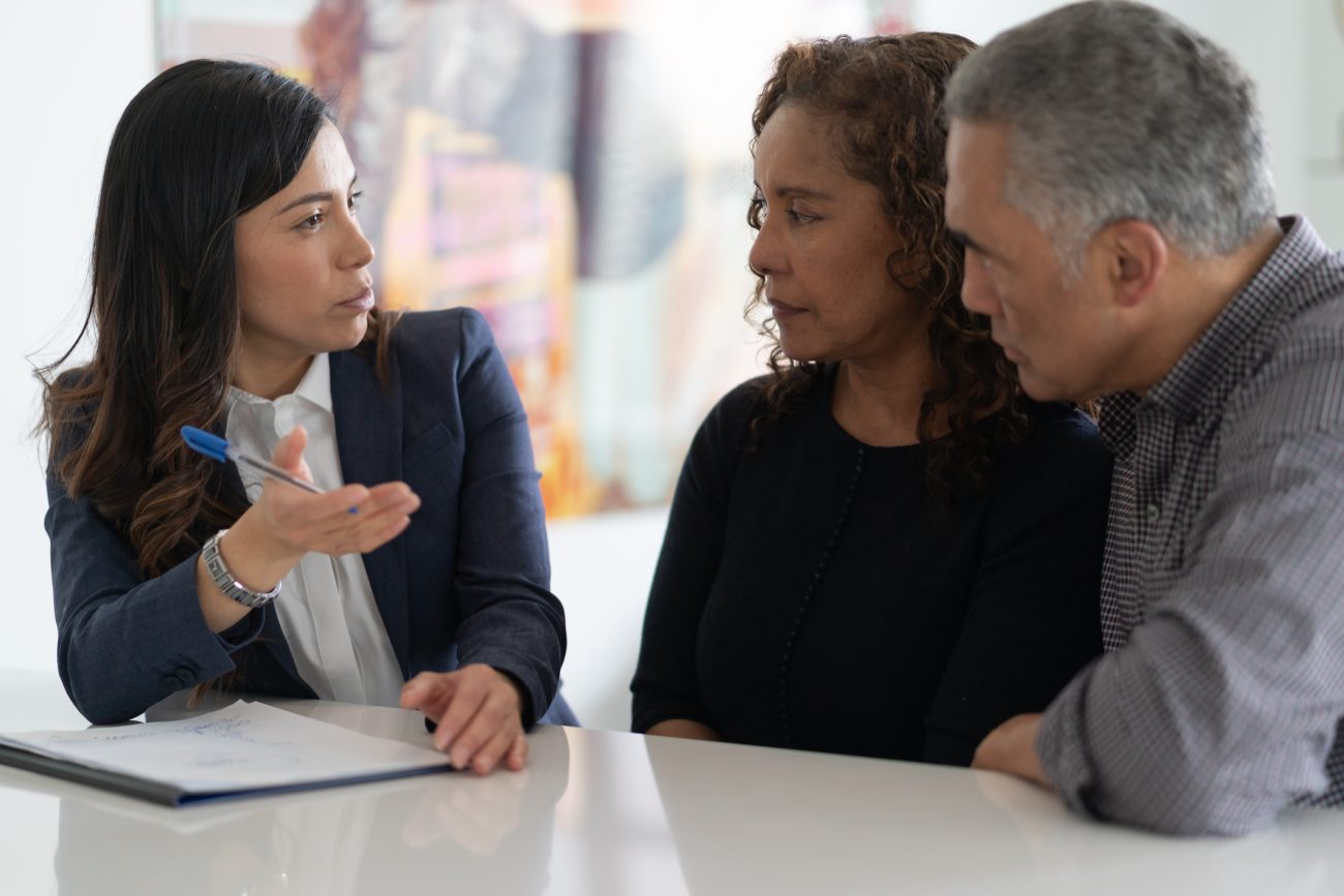 Ethnic Senior Couple With Financial Advisor