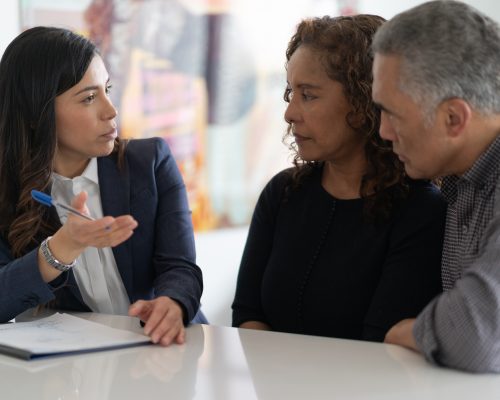 Ethnic Senior Couple With Financial Advisor